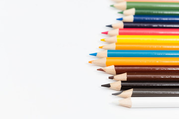 Multi color pencils. the concept of a multinational family and equality in the world.