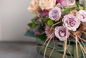 Beautiful bouquet of flowers in a wooden vintage box. greeting card. blurred background, copy space