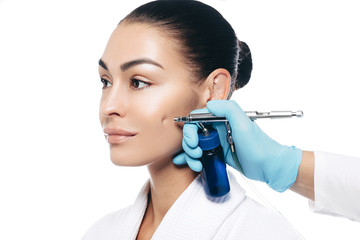 Anti-aging face peel, procedure renewing skin , jet peeling. woman during jet peeling procedure on...