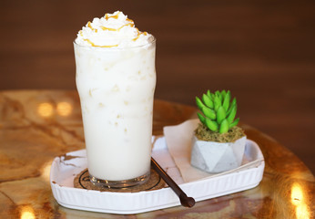 Cold milk on table at cafe.