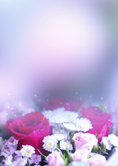 Delicate floral background with copy space under the text. Blurred background with spring flowers, bokeh. Bouquet of flowers close-up