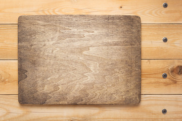 wooden sign board and shelf at wall