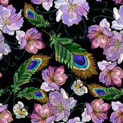Embroidery wild pink flowers and peacock feather seamless pattern. Fashion template for clothes, textiles and t-shirt design
