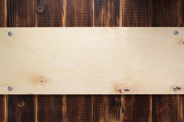 nameplate or wall sign at  wooden background