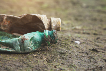 plastic pollution, ecological environmental problem, spilled garbage, empty crumpled used plastic bottles on the ground