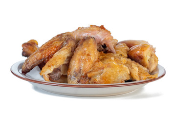 Roasted chicken on the plate isolated on white background