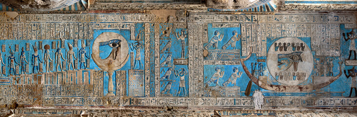 Hieroglyphic carvings and paintings on the interior walls of an ancient egyptian temple - obrazy, fototapety, plakaty