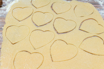 Hearts shape cookies cooking process. Valentines day gift preparation dating.
