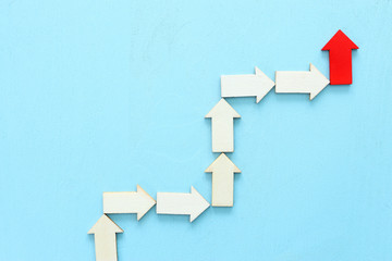 Business leadership concept, red arrow leader with group of followers