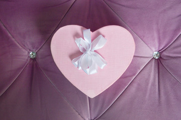 The pink box in the shape of a heart. Box for a gift. Preparing for the holiday. Happy holiday.
