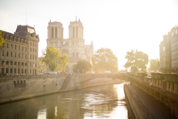 Fototapeta na wymiar Sunny morning in Notre dame Paris France with sun flair and beautiful scenery 