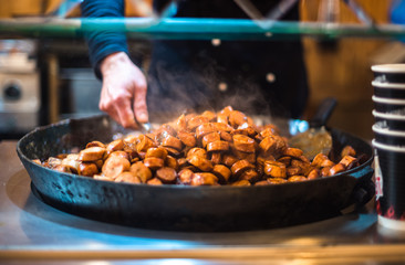 Christmas market uk manchester festival night winter holiday decoration people food weiner wurst...