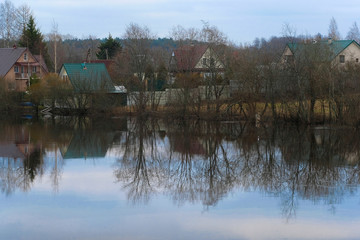 Fototapeta premium country houses on a bank of Volhov river in Volhov, Russia