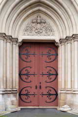 Detail of a wooden and wrought iron door of church in France