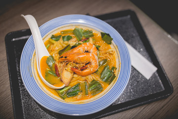 Spicy soup and seafood Udon Japanese noodles in japanese restaurant