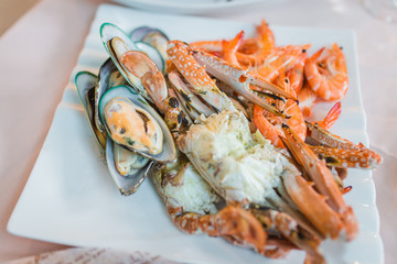 Delicious seafood of fresh seafood with shrimps, prawns, crabs, salmon, squid and mussels at luxury restaurant