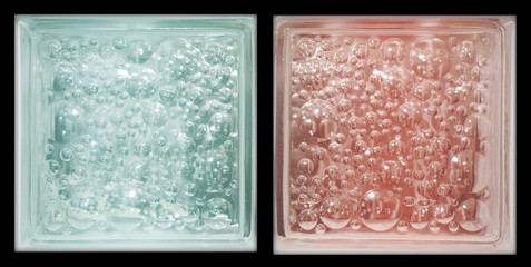 Transparent red blue square bathroom glass block cube in black background with circle bubble pattern rough texture .Use for object and material. Arrange in double way and can be connected to others.