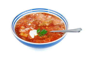 Porcelain bowl with traditional Ukrainian borscht (beet root soup) isolated on white background.