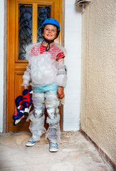Child with rollerblades near door in bubble wrap