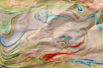abstract color stains on crumpled paper texture