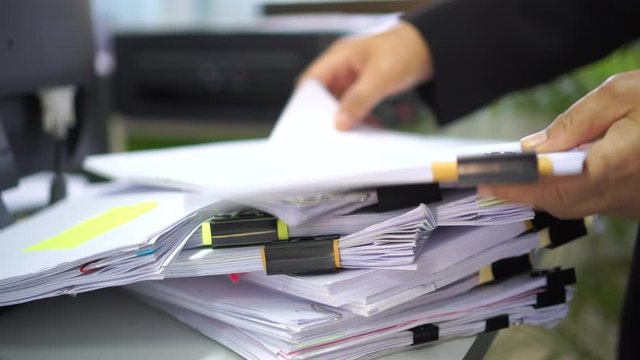 Auditor businesswoman checking information document legal prepare paperwork,feeling angry when can not find info report for analysis in TAX time, accountant in workload contract partner deal in office