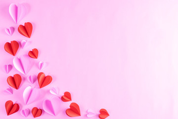 Pink and red hearts on pastel pink paper background. Copy space. Valentines day, Women's day, Mother's day concept.