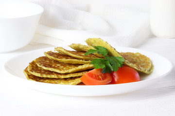 Vegetarian pancake with spinach and tomato