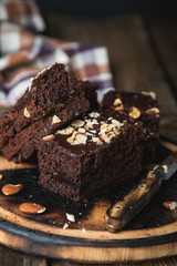 Homemade chocolate cake with almonds on the table