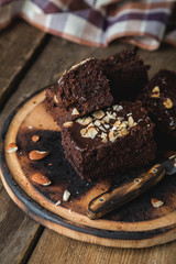 Homemade chocolate cake with almonds on the table