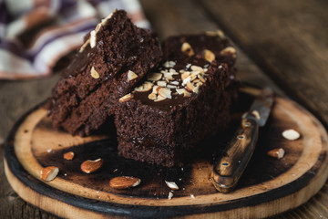 Homemade chocolate cake with almonds on the table