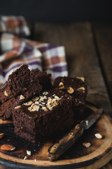 Homemade chocolate cake with almonds on the table