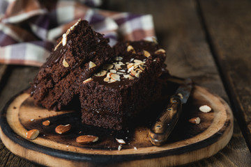 Homemade chocolate cake with almonds on the table