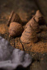 Chocolate truffles on a wooden table