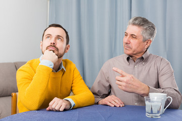 Mature father and son serious talk