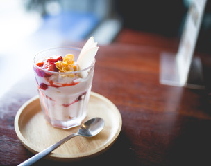 homemade fruit yoghurt with strawberry jam, apple and conflake