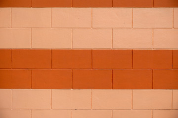 Two tone color of orange brick wall for background.