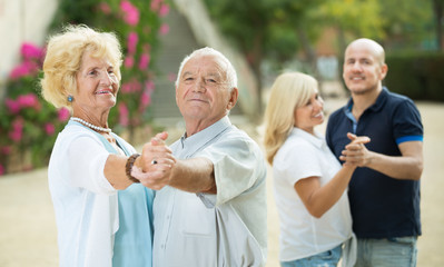 Mature friends dancing walts