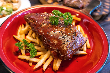 Pork Rib with French Fried in the Red plate