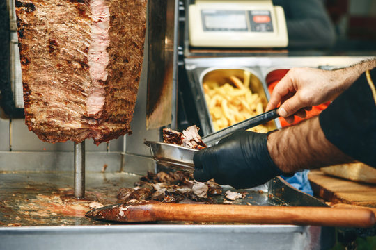 The process of preparing traditional Turkish fast food - grilled meat or shawarma or kebab