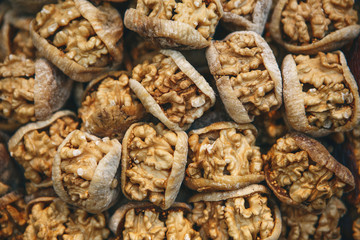 Walnuts inside dried figs traditional oriental sweet food background