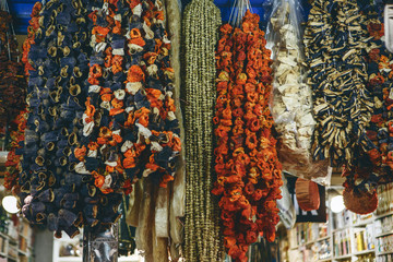 Traditional dry seasoning vegetables hang in a market in Istanbul in Turkey. Authentic food or seasoning on food