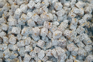 Closeup traditional Turkish sweet food with nuts and sprinkled with coconut crumbs - Rahat Lokum