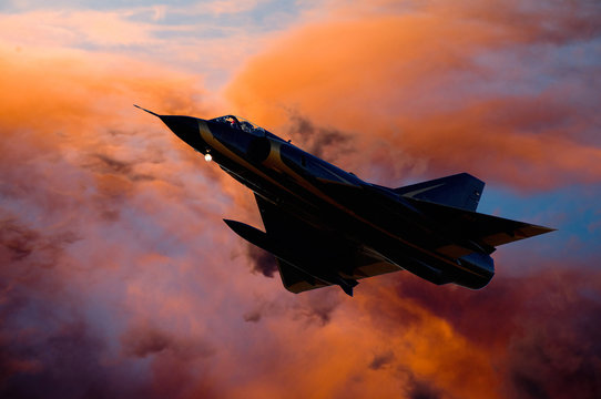 Composite image of fighter jet aircraft silhouette against orange clouds