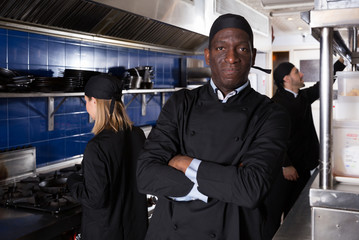 African American chef in restaurant kitchen