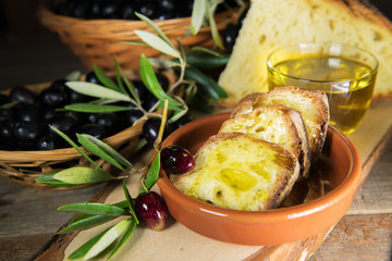 Sliced bread with extra virgin olive oil made in Salento, Puglia, Italy. Tradicional starters of...