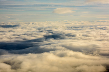Above the Clouds. Top view. View from drone. Aerial bird's eye view. Aerial top view cloudscape. Texture of clouds. 