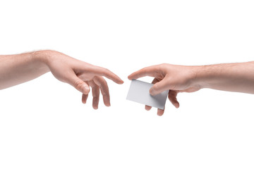 Two male hands passing one another blank business card on white background