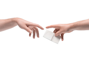 Two male hands passing one another a facial tissue on white background