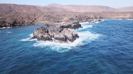 waves crashing on rocks