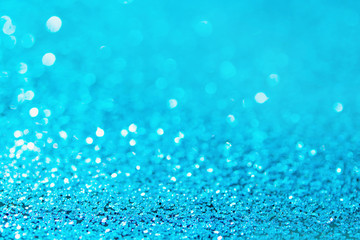 Defocused blue glitter background. blue abstract bokeh background. Christmas abstract background.